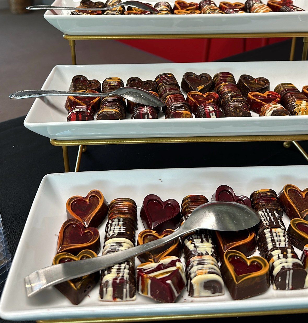 Tiered trays of Cioccoland marbled bonbons served at a private event